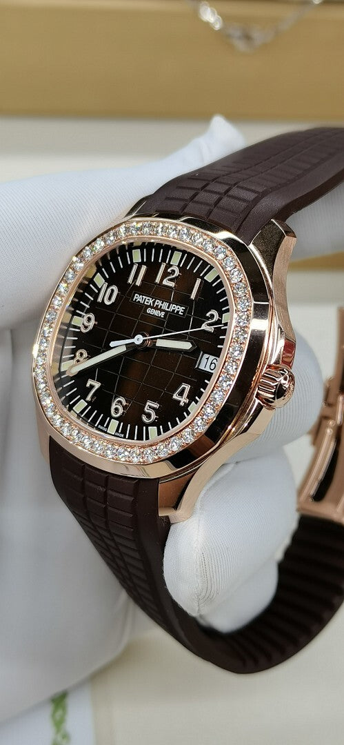 Brown leather strap wristwatch with black dial, white numerals, diamond bezel