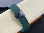 Wristwatch buckle with green rubber strap and square metal clasp