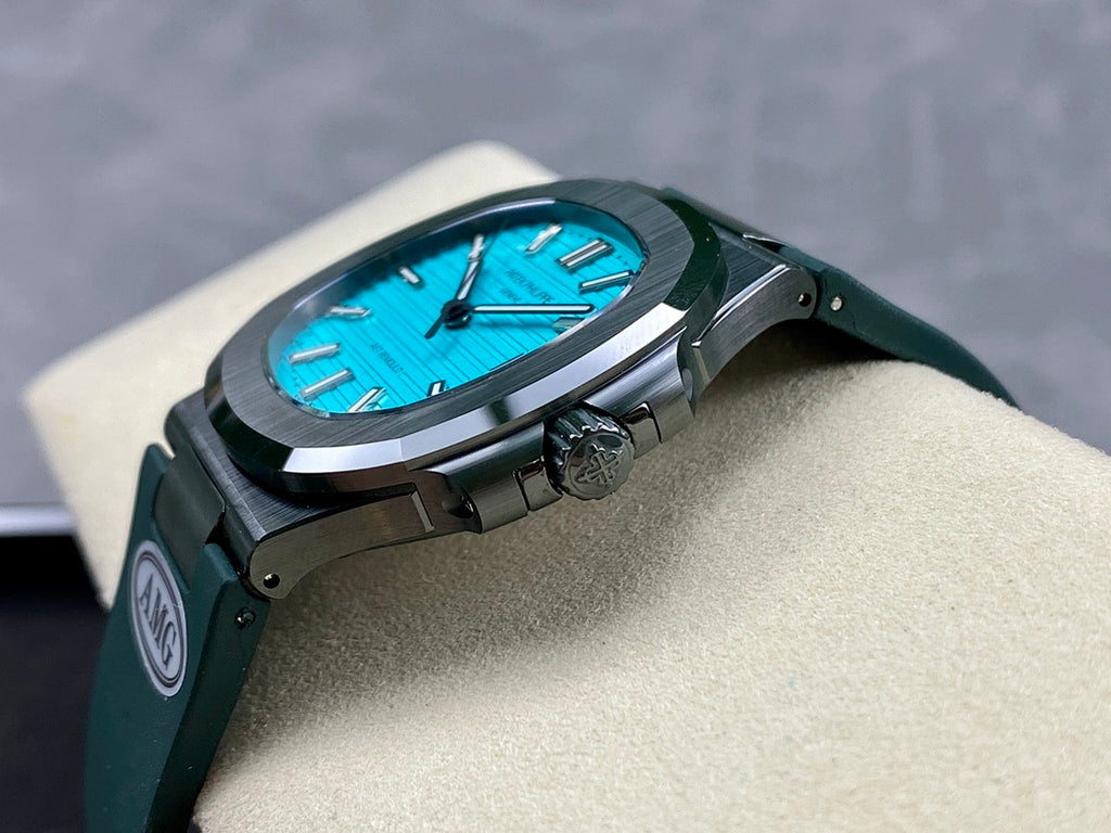 Wristwatch on cushion, blue dial, green strap, round dark case