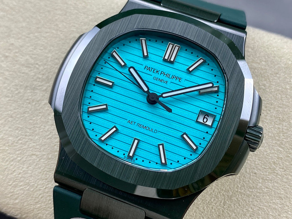 Patek Philippe wristwatch, blue dial, green rubber strap, dark bezel, date window