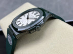 Patek Philippe wristwatch on green strap with silver case and white dial, angled view