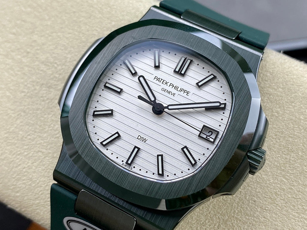 Patek Philippe wristwatch with green rubber strap and silver dial, black hour markers