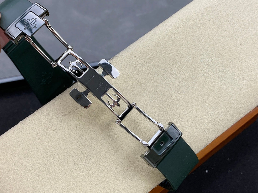 Patek Philippe watch bracelet with dark green strap links and silver metal clasp