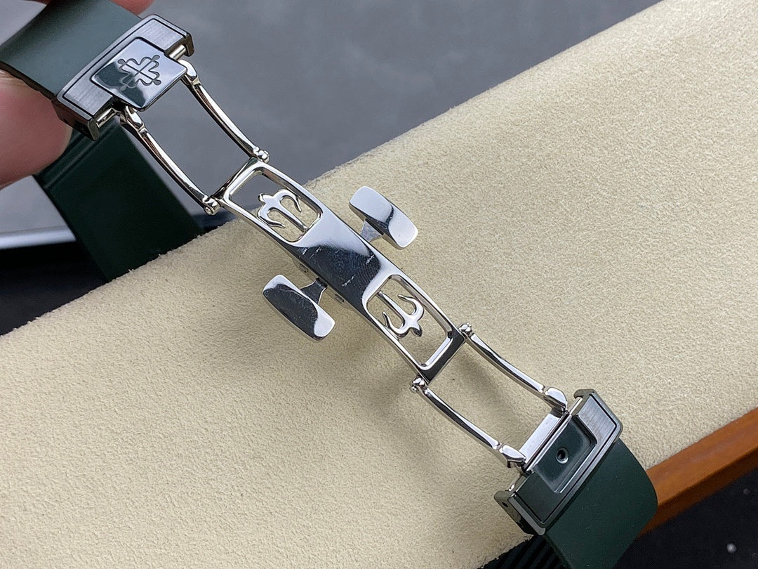 Patek Philippe watch bracelet clasp with green links and silver hardware, engraved markings
