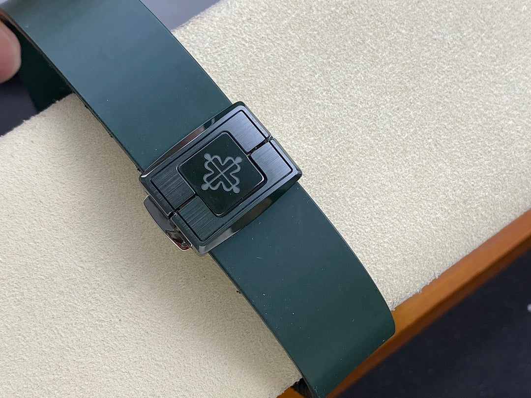 Patek Philippe watch buckle with green strap and engraved emblem on silver-toned clasp