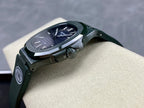 Patek Philippe wristwatch angled view with green rubber strap, silver case, dark blue dial
