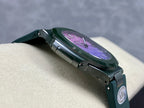 Patek Philippe watch side view with dark teal strap and purple dial through round case.