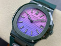Patek Philippe watch with dark teal metal strap and purple dial, round bezel detail.