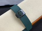 Patek Philippe watch strap buckle with logo panel and green band