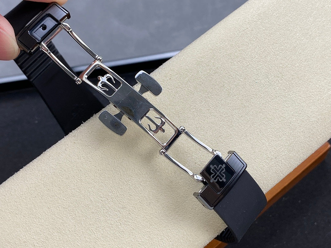 Luxury wristwatch strap with metal clasp and links, dark rubber band with emblem panel
