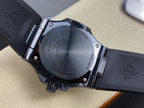 Luxury wristwatch caseback on dark strap, engraved text on round brushed back plate