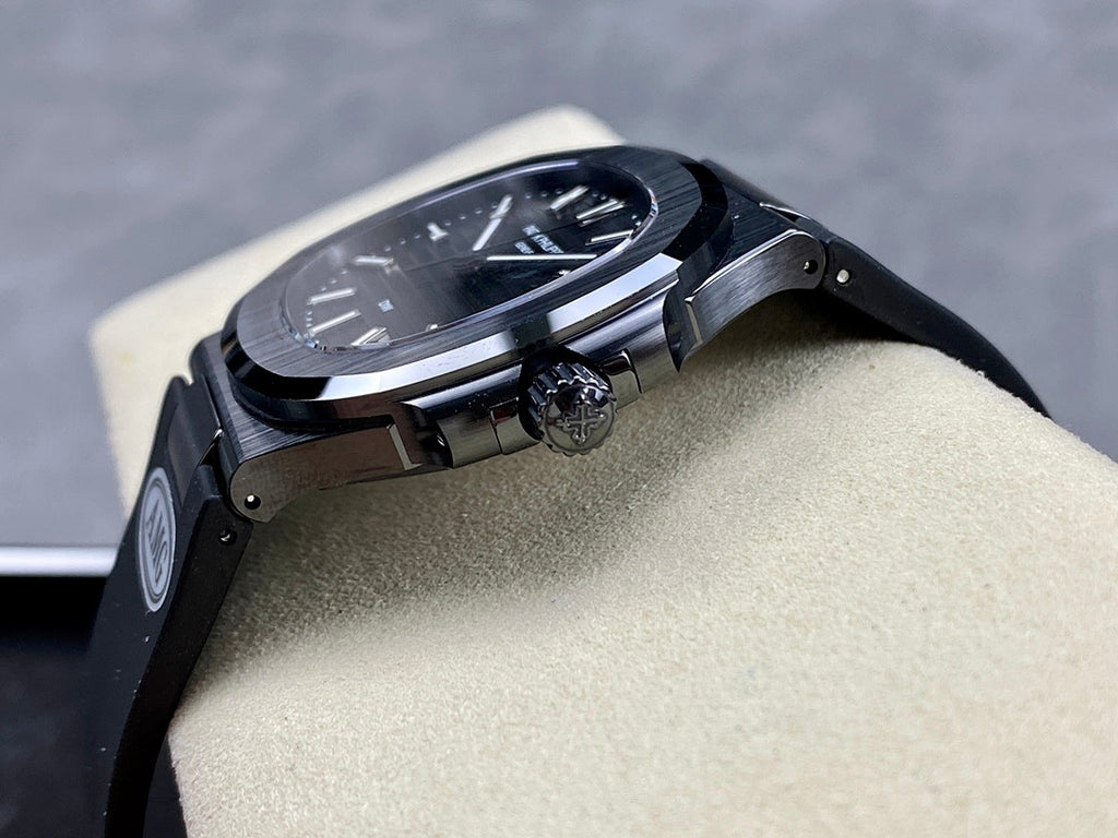 Luxury wristwatch side profile with crown and dark metal bracelet links