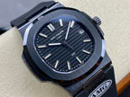Luxury wristwatch close-up with dark dial, silver markers, and date window at 3 o’clock