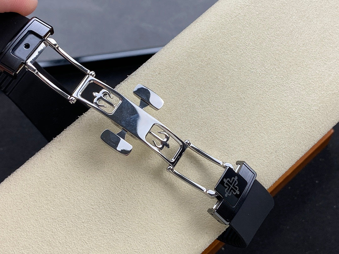 Patek Philippe watch bracelet with metal links and clasp, on black strap
