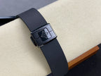 Patek Philippe watch with black strap and metal buckle clasp
