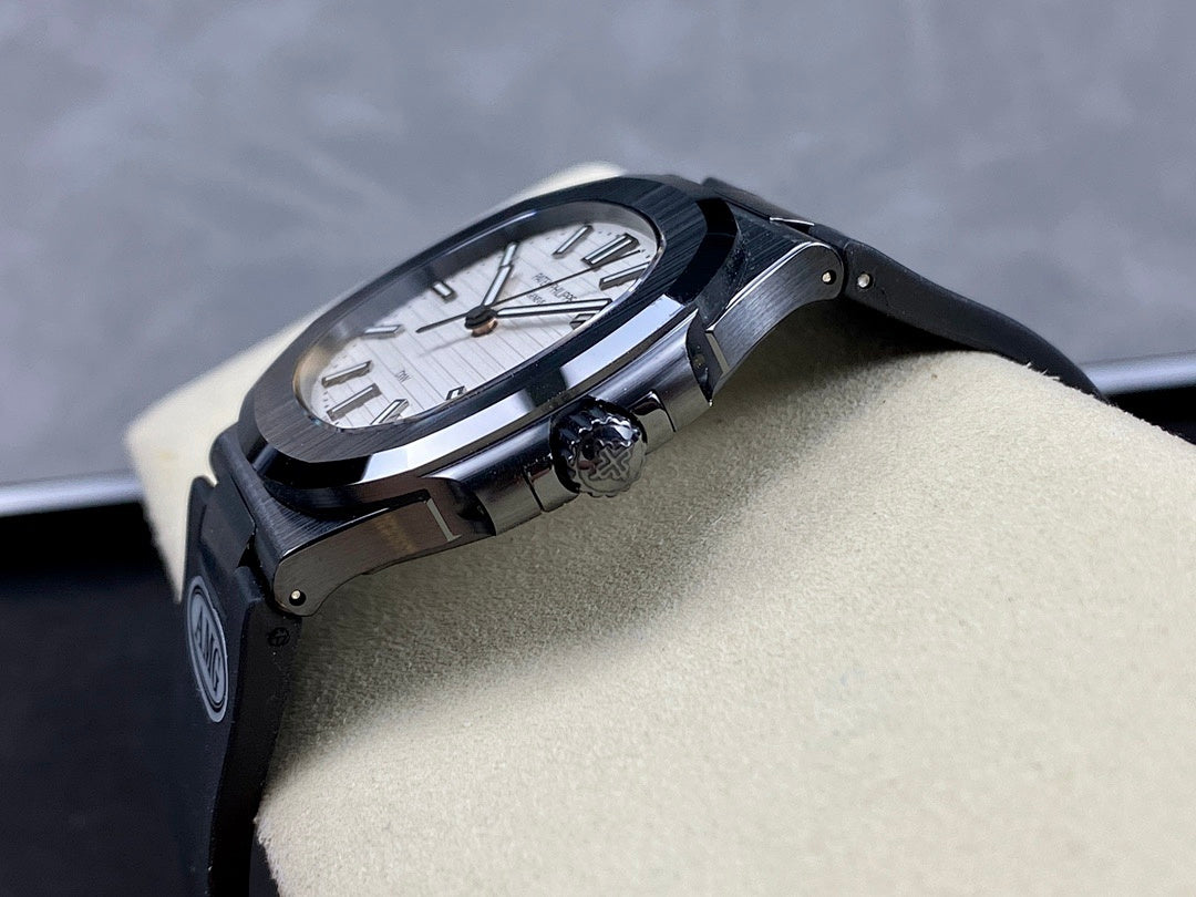 Patek Philippe watch side view with dark case and bracelet on a beige display