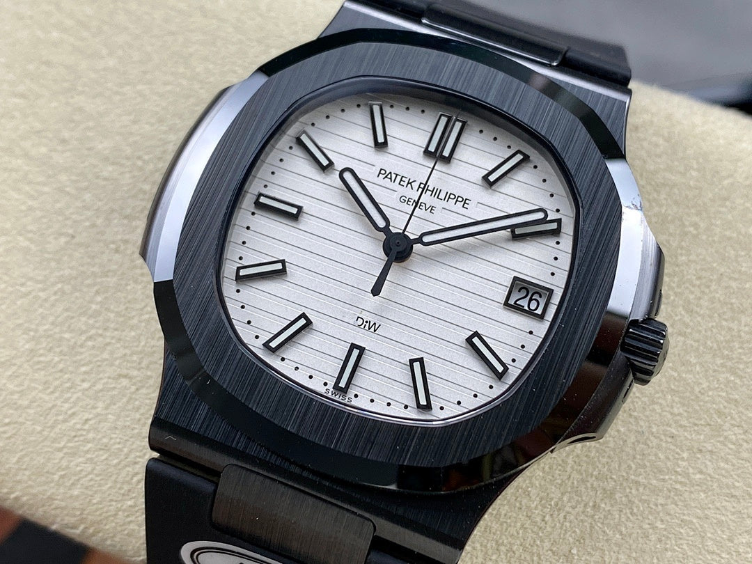 Patek Philippe watch with silver dial, dark bezel, black rubber strap, date window