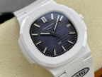 Patek Philippe wristwatch close-up with white bezel, dark blue dial, and date at 2