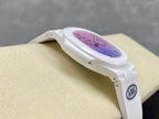 White watch on wrist display, side profile with purple dial and AMG badge.