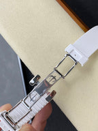 White link bracelet wristwatch with polished metal deployant clasp.