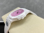 White wristwatch angled view with pink dial and crown on the right side.