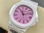 White wristwatch with pink dial, black baton markers, and date window at 3 o’clock.