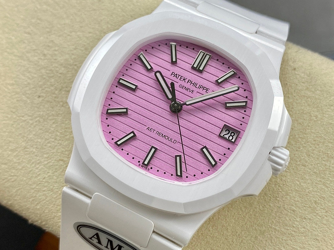 White wristwatch with pink dial, black baton markers, and date window at 3 o’clock.