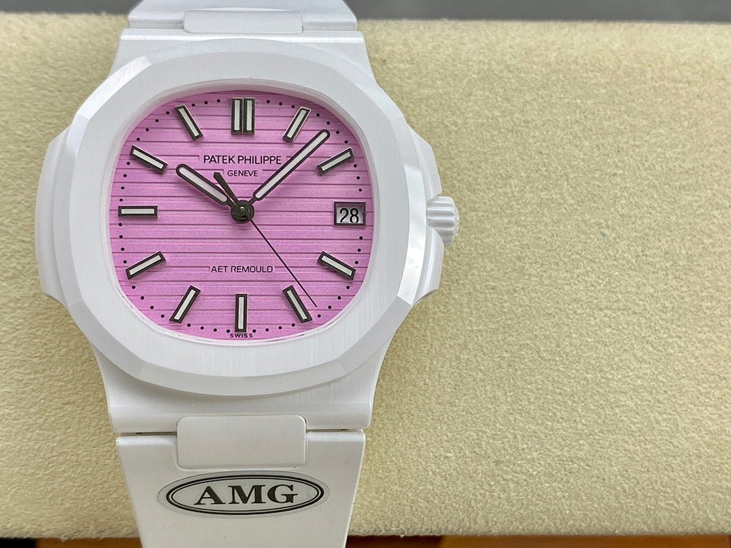 White wristwatch front view with pink dial, baton hands, and date window at 3 o’clock.