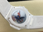 White wristwatch case back with illustrated emblem artwork and metal screws