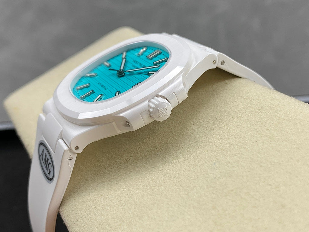White wristwatch side profile with turquoise dial, crown, and strap lugs