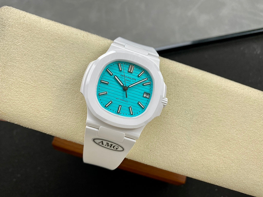 White wristwatch on strap with turquoise dial and dark baton indices
