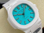 White wristwatch face with turquoise dial, baton hands, and date at 3