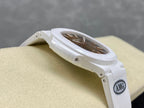 White wristwatch with brown dial, showing side AMG logo plate