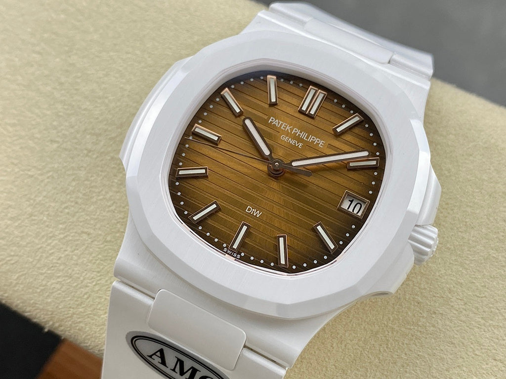 White wristwatch with brown dial, date window, and three-hand hour markers