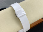 White watch strap with engraved buckle on the closure