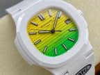 White sport watch close-up with green-yellow dial, baton markers, and date window