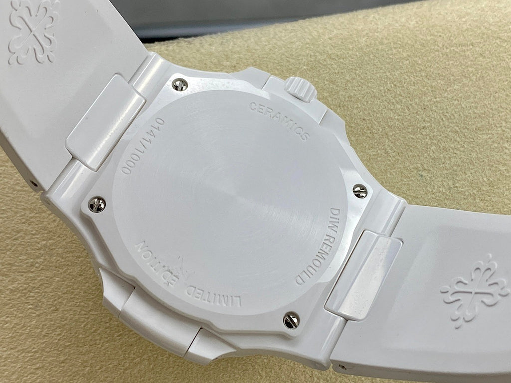 Patek Philippe wristwatch case back on white band, engraved markings and screws