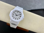 Patek Philippe wristwatch on beige cushion, white dial with black indices and hands