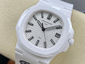 Patek Philippe wristwatch with white dial, black hour markers, and white strap