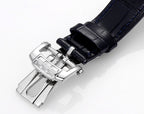 Wristwatch buckle clasp with blue leather strap and polished metal hardware