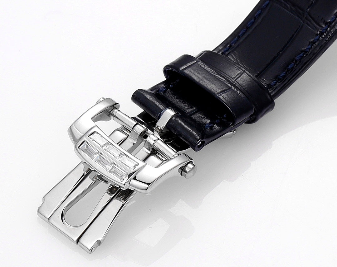 Wristwatch buckle clasp with blue leather strap and polished metal hardware