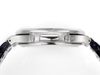 Wristwatch case with polished back plate, side details, and blue leather strap ends