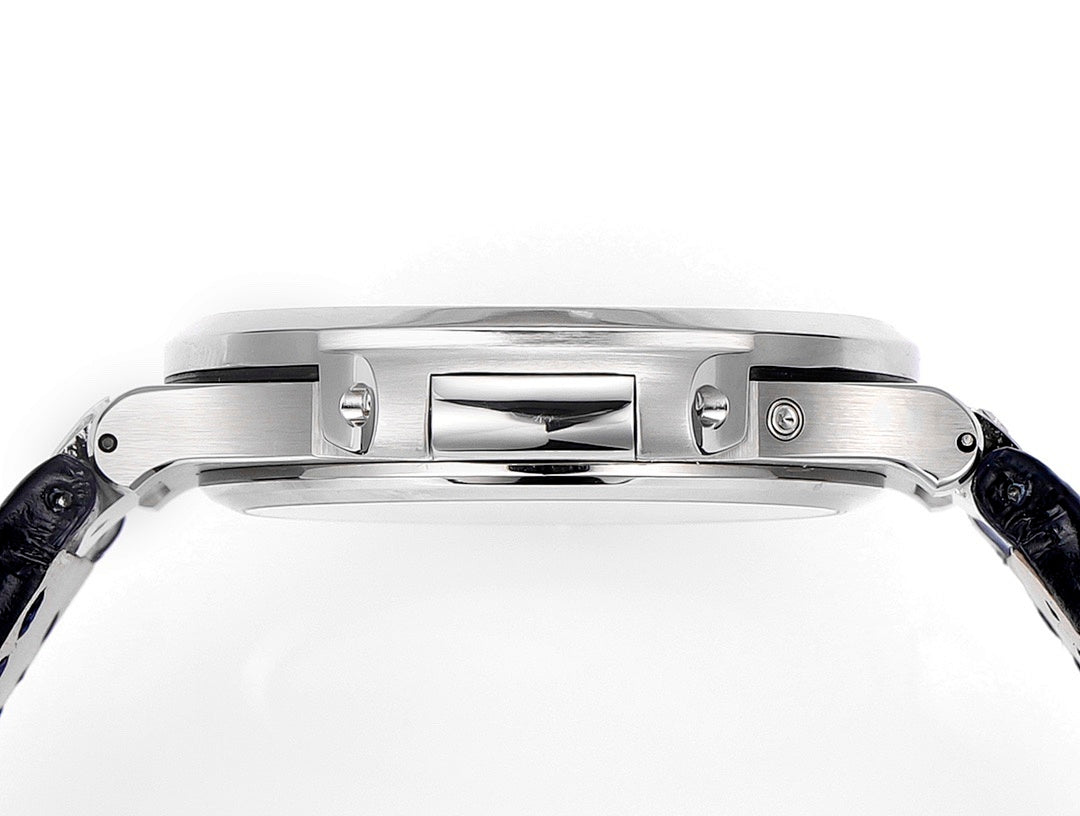 Wristwatch case with polished back plate, side details, and blue leather strap ends