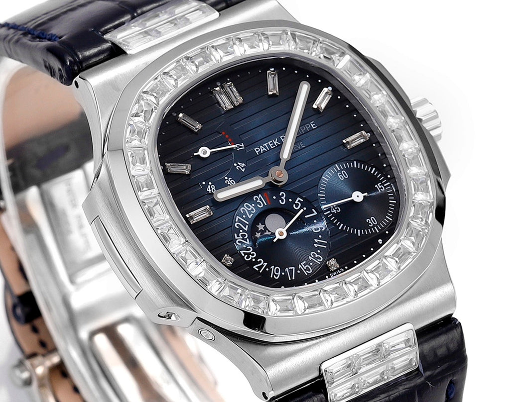 Close-up of wristwatch dial with blue background, gem-set bezel, and stainless hands
