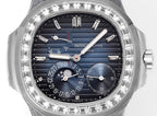 Close-up of wristwatch face with blue dial, multiple subdials, and gem-set bezel