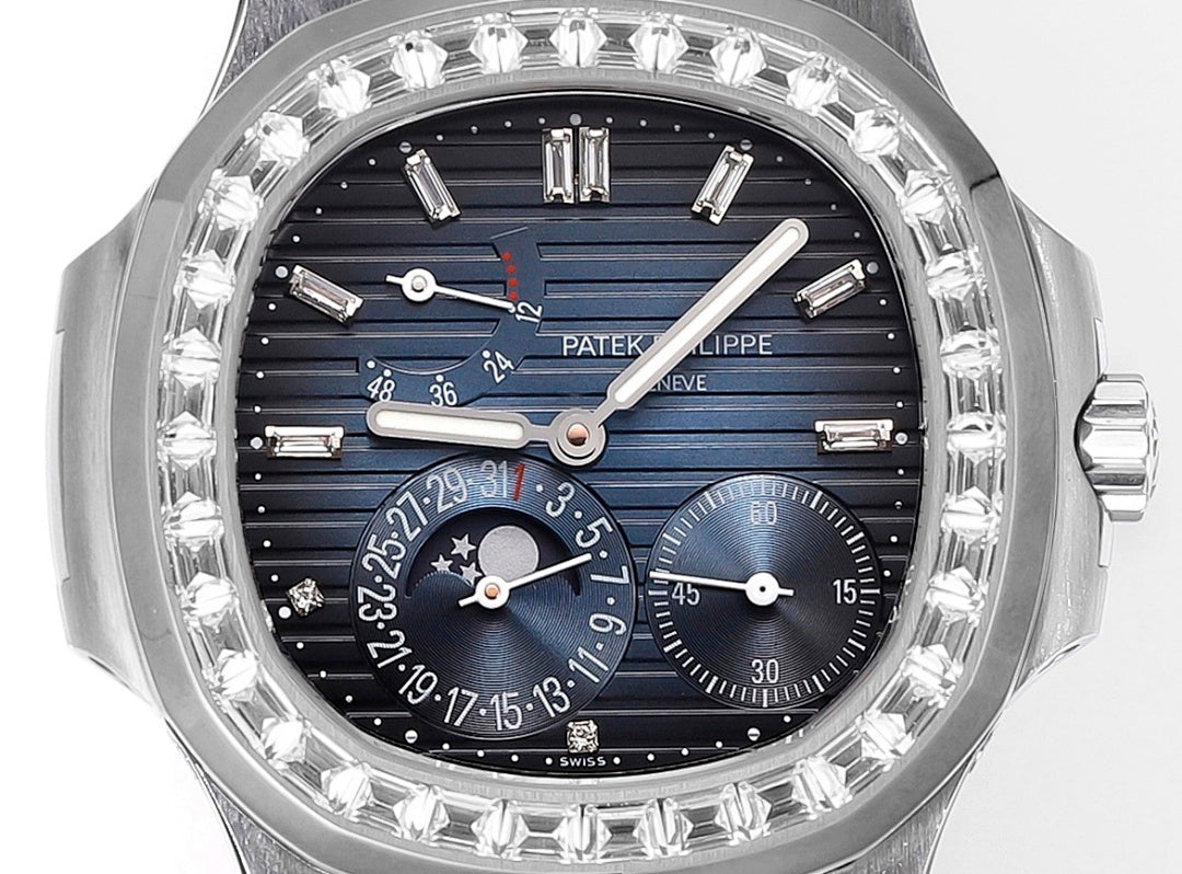 Close-up of wristwatch face with blue dial, multiple subdials, and gem-set bezel