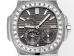 Patek Philippe watch face close-up with black dial, diamond bezel, and multiple subdials.