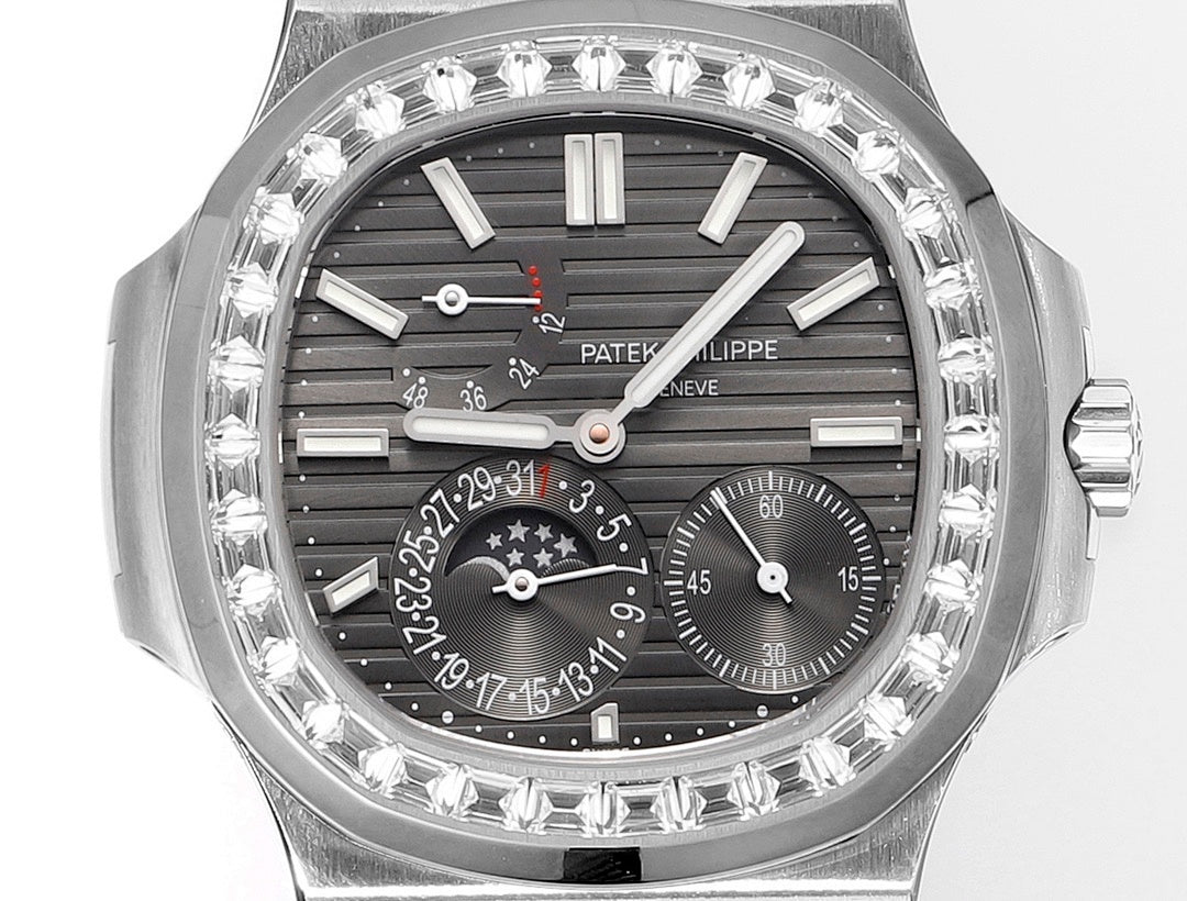Patek Philippe watch face close-up with black dial, diamond bezel, and multiple subdials.