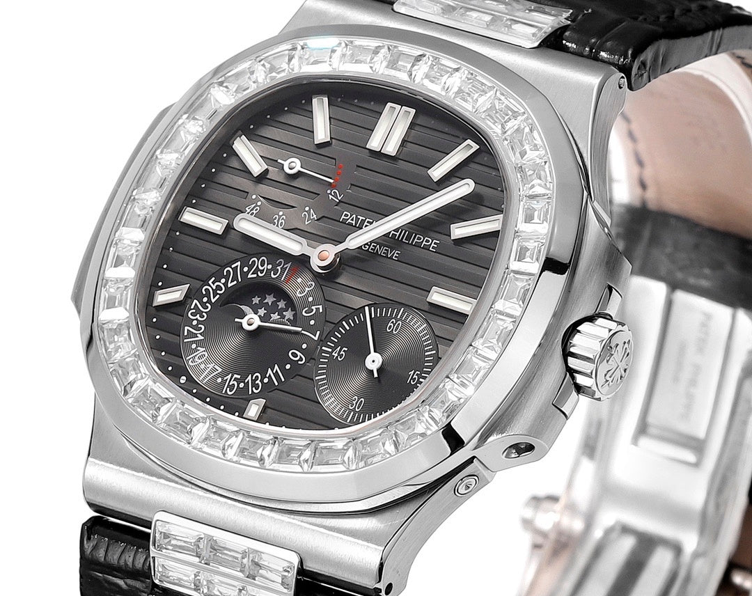 Patek Philippe watch close-up with black dial, diamond bezel, and silver crown at right.