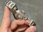 Patek Philippe steel watch showing bracelet and side crown details